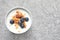 Bowl with yogurt, berries and granola on table