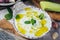 Bowl of yogurt and cucumber sauce closeup