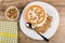 Bowl with yogurt, flakes, spoon in dish, bowl with flakes