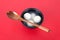 A bowl of Yuanxiao or Tangyuan and spoon on a red background