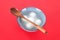 A bowl of Yuanxiao or Tangyuan and spoon on a red background