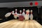 Bowling ball hitting all 10 pins, in a Strike