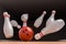 Bowling ball is knocking down pins Strike. 3D rendered illustration