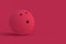 Bowling ball of magenta on red background. Color of the year 2023