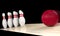 Bowling ball moving straight to bowling pin. Indoor sport concept