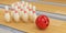 Bowling ball and skittles stand on the bowling track. 3D render