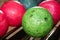 Bowling balls red green closeup row