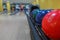 Bowling balls return machine, alley background