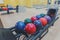 Bowling balls return machine, alley background