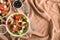 Bowls with delicious watermelon salad on table, top view