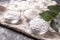 Bowls with different kinds of sugar on grey table