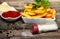 Bowls with french fries, tomato sauce and mayonnaise with bottle