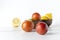 Bowls full of fresh and juicy fruits.Blood oranges, lemons and lime in white table against white background