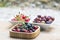 Bowls full of fruit on wooden surface