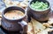 Bowls of guacamole and queso with tortilla chips