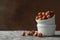 Bowls hazelnuts on gray table. Vitamin food