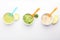 Bowls with healthy baby food on white background
