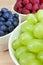 Bowls of Healthy Grapes, Blueberries & Raspberries