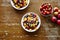 Bowls of heathy organic muesli with fruits on wooden table healthy lifestyle