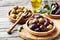 Bowls with marinated olives. Mediterranean snack or appetizer.