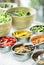 Bowls of mixed fresh organic vegetables in salad bar display