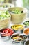 Bowls of mixed fresh organic vegetables in salad bar display