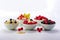 Bowls of oatmeal with berries and fruits on white background. Generative AI