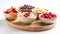 Bowls of oatmeal with mixed berries on wooden serving tray. Ingredients in the Portfolio Diet. Copy space.