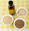 Bowls with oats, buckwheat, brown rice and bottle oil