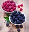 Bowls overflowing with summer berries like