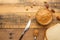 Bowls of peanut butter and peanuts on a dark wooden background from top view, rich breakfast