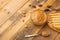 Bowls of peanut butter and peanuts on a dark wooden background from top view, rich breakfast