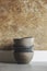 Bowls of polished cement, handmade, stacked on the kitchen