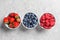 Bowls with raspberries, strawberries and blueberries