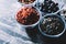 Bowls with superfoods on marble kitchen counter