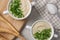 Bowls with tasty creamy soup of parsnip served on light grey table, flat lay