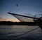 Bowsprit of a sailboat and sunset