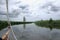 Bowsprit of a sailing yacht on a tranquil river