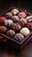 Box of assorted chocolates on a wooden table, closeup view