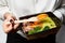 a box of food in the hands of a waiter