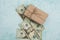 Box with a gift on the background of money studio image. Money dollars with Christmas gift concept of spending on gifts