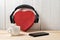 Box heart shape with headphones, phone and cup. Love music concept