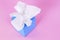 Box of kleenex style paper tissues, pink background, copy space