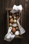 Box with quail and chicken eggs Photo