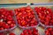 Box of ripe red wild strawberries for sale in small town Nemi, Castelli Romani, near Rome, Italy