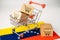 Box with shopping cart logo and venezuela flag, Import Export Shopping online or eCommerce finance delivery service store product