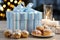 A box of Sufganiyot tied with a blue ribbon, alongside small Hanukkah gifts wrapped in festive paper. The setting is cheerful and