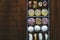 Box of sweets with fruit pasta chocolates and dried fruits lying on a wooden table