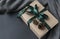 Box tied with green ribbon, gift box, cones, on the background o