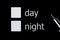 A box to check the box next to your choice between day and night. Squares on a black background